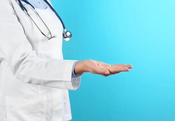 Female Doctor Offering Helping Hand Color Background Closeup — Stock Photo, Image