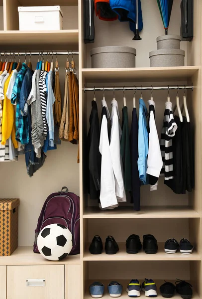 Large wardrobe with teenager clothes, shoes and accessories