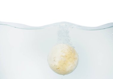 Bath bomb in water on white background clipart
