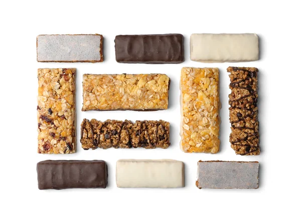 Flat lay composition with protein bars on white background