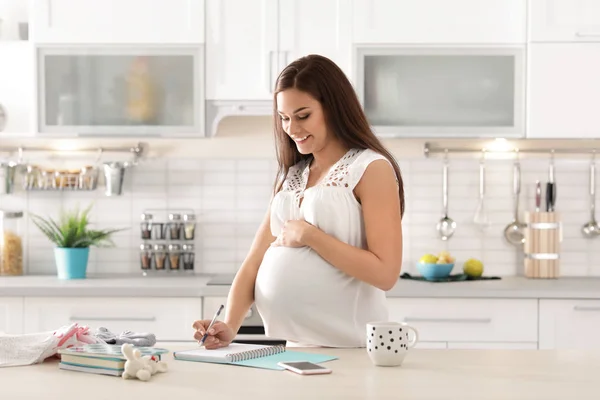 Pregnant Woman Writing Packing List Maternity Hospital Kitchen — Stock Photo, Image