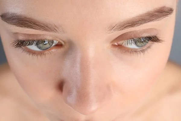 Young woman with beautiful natural eyelashes, closeup