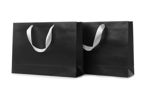 白い背景の上のリボン ハンドルと紙のショッピング バッグ デザインのモックアップ — ストック写真