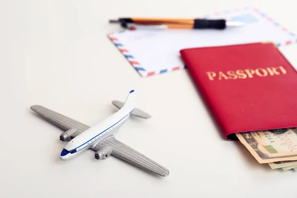 Samenstelling Met Speelgoed Vliegtuig Paspoort Geld Witte Achtergrond Reisverzekering — Stockfoto