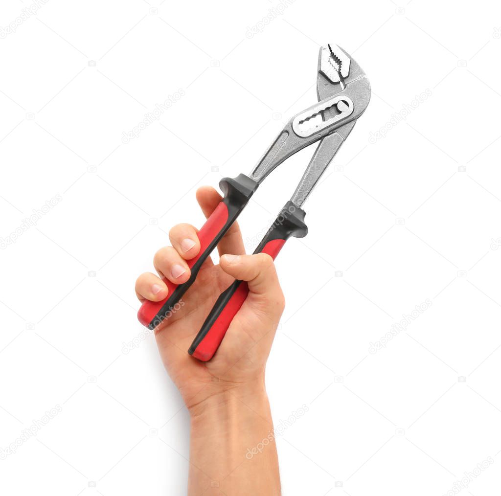 Plumber holding rib joint pliers on white background, closeup