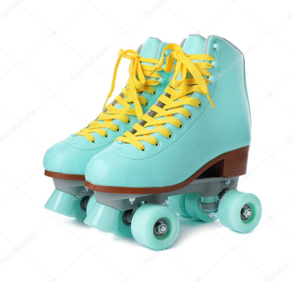 Pair of stylish quad roller skates on white background