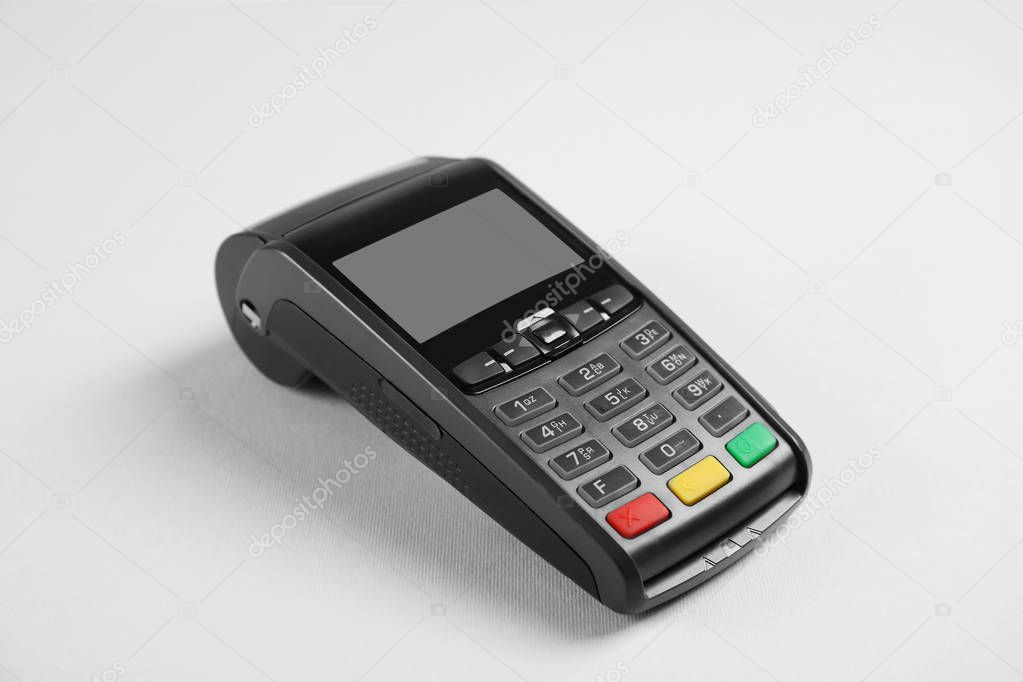 New modern payment terminal on grey background