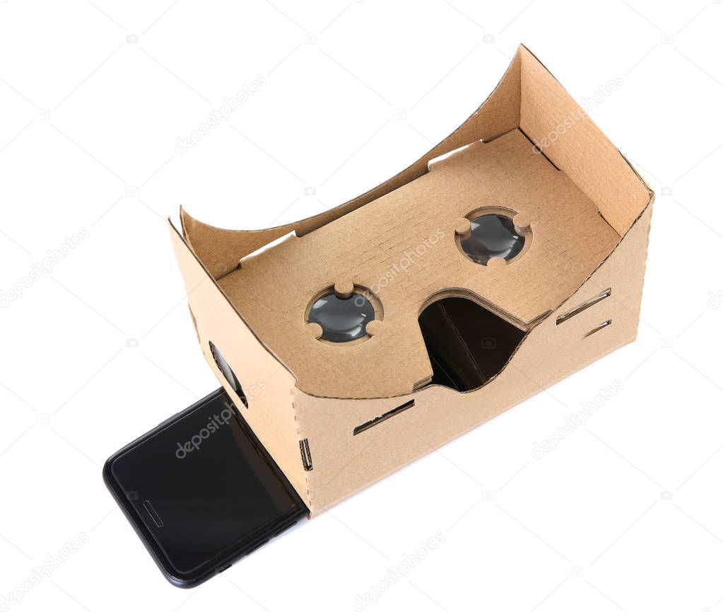 Cardboard virtual reality headset and smartphone on white background