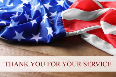Text THANK YOU FOR YOUR SERVICE and USA flag on wooden background clipart