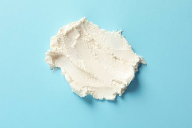 Smear lezzetli krem peynir renk arka plan, üstten görünüm