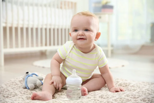 Cute Baby Bottle Sitting Floor Room — Stock Photo, Image
