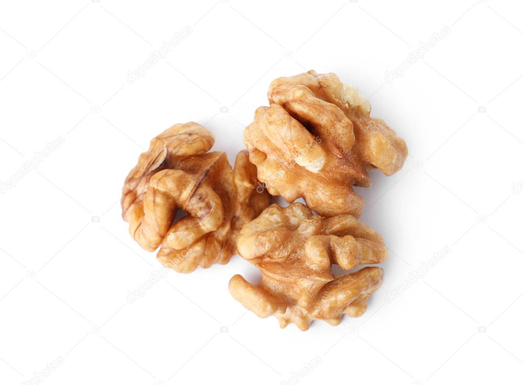 Tasty walnuts on white background, top view