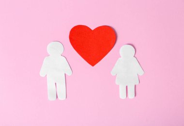 Kağıt çift renk arka plan üzerinde kırmızı kalp ile. Romantik duygular