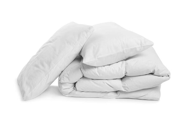 Clean blanket and pillows on white background