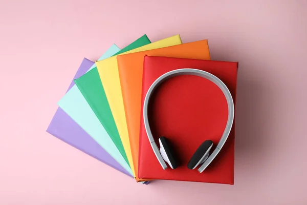 Modern Headphones Hardcover Books Color Background Top View — Stock Photo, Image