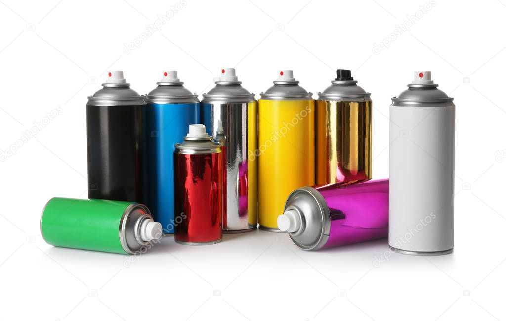 Cans of different spray paints on white background