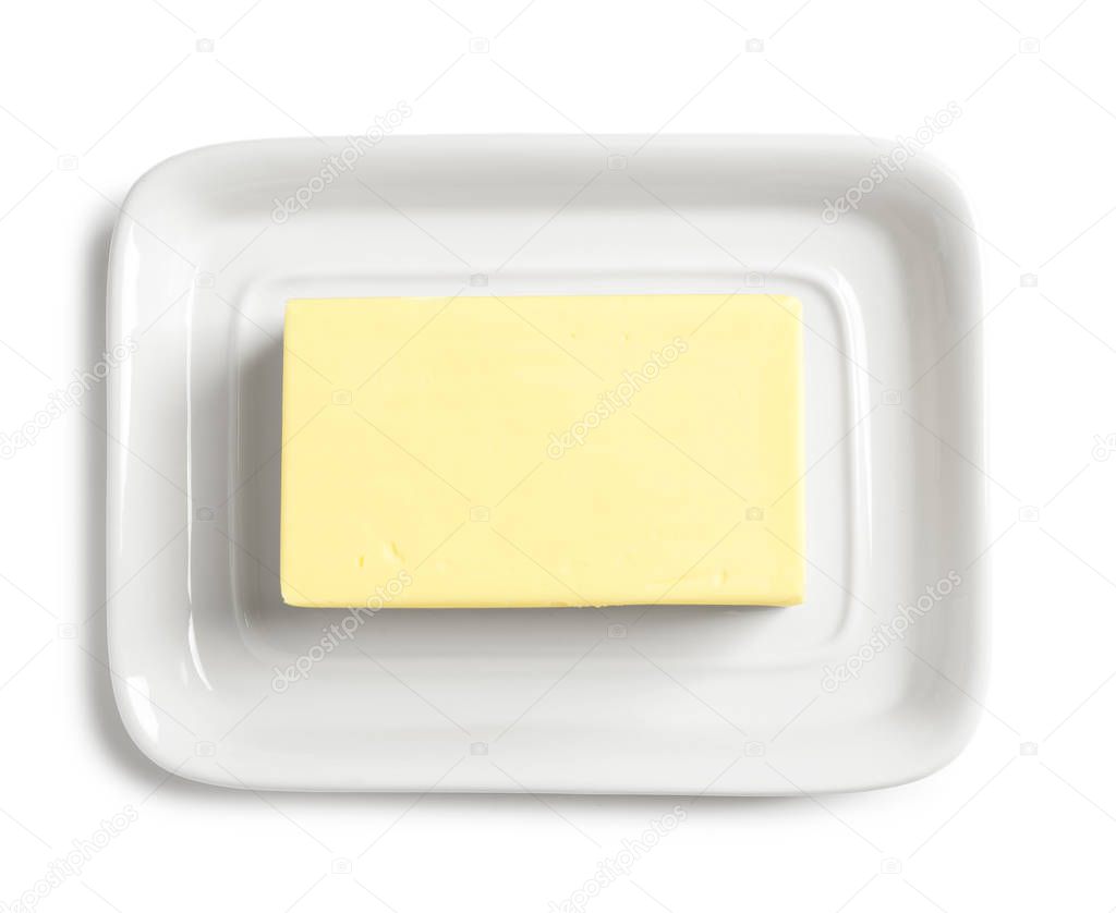Ceramic dish with block of fresh butter on white background, top view