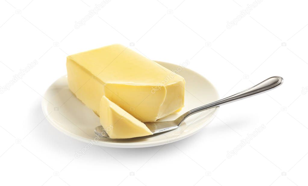 Plate with fresh butter and knife isolated on white