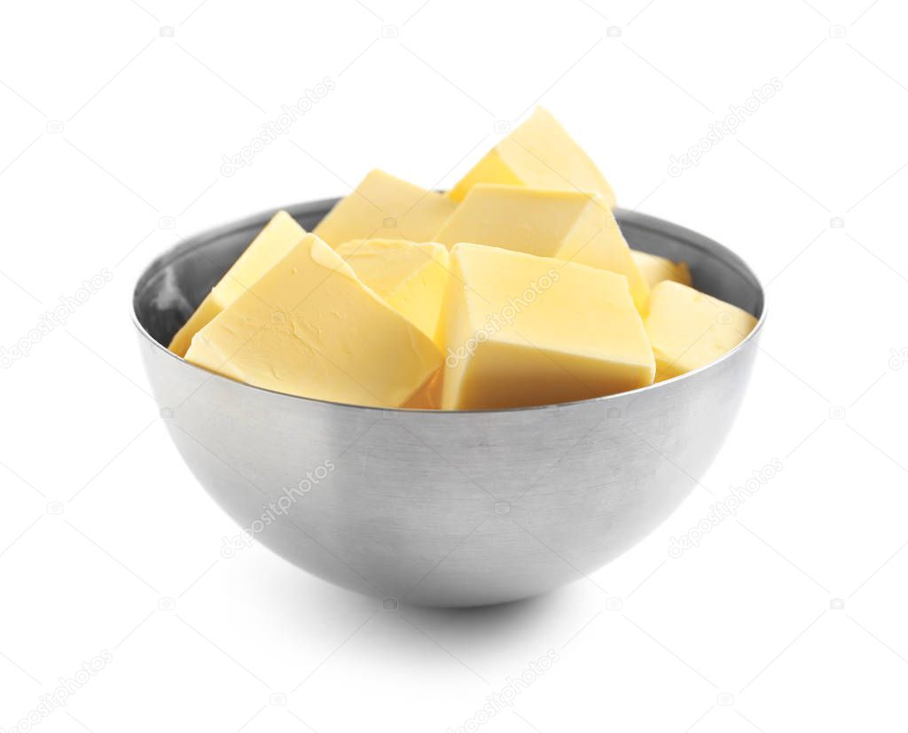 Bowl with cubes of fresh butter on white background