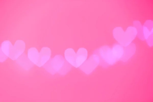 Verschwommene Ansicht Der Schönen Herzförmigen Lichter Auf Farbigem Hintergrund — Stockfoto