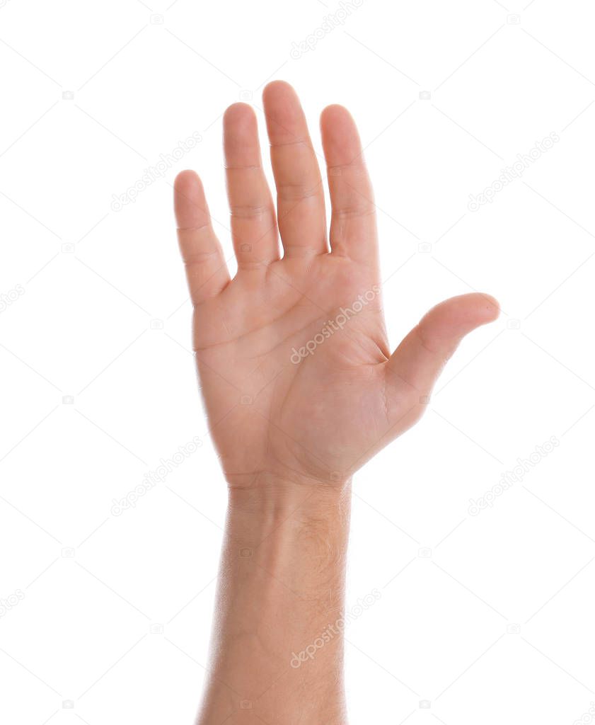 Man showing palm of hand on white background, closeup
