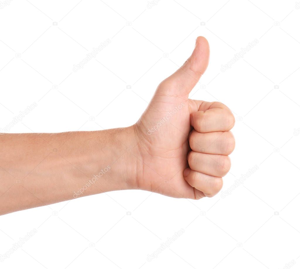Man showing thumb up gesture on white background, closeup of hand