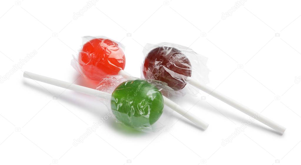 Different delicious colorful candies on white background