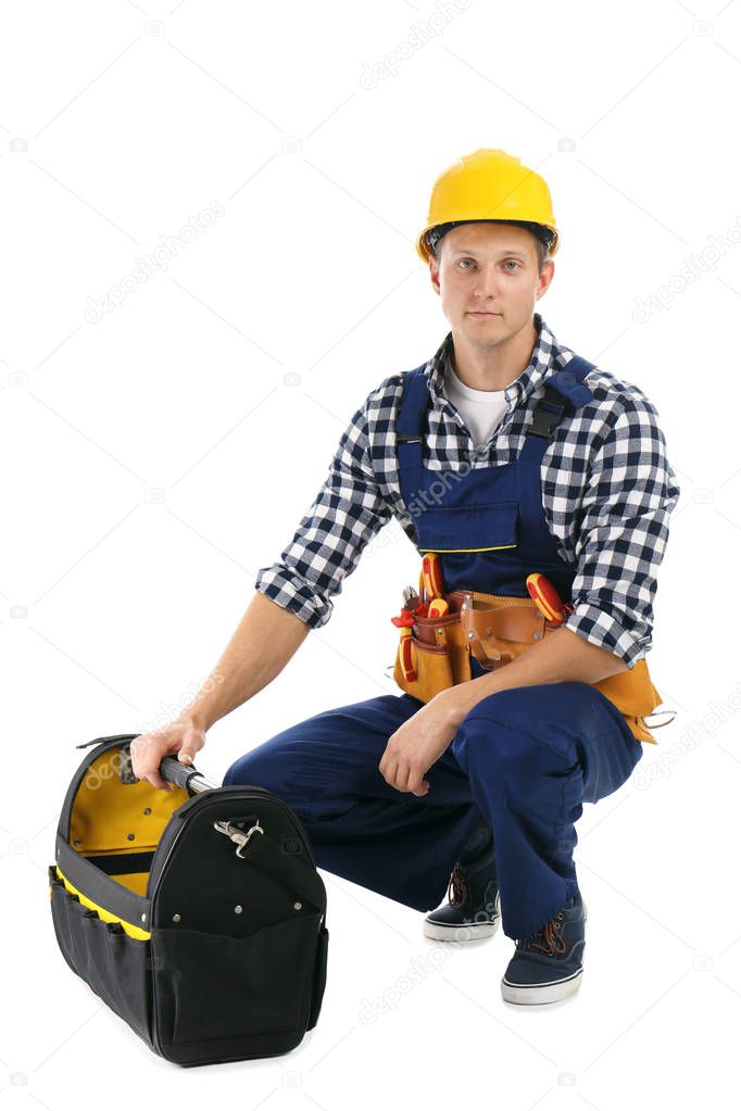 Electrician with tools wearing uniform on white background