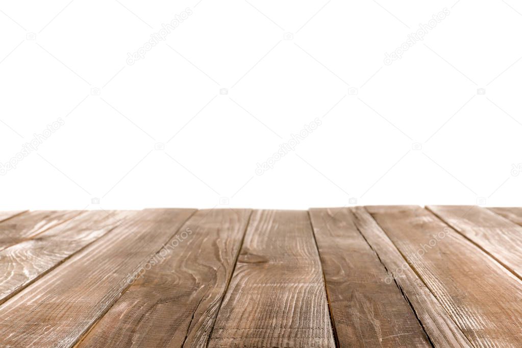 Empty wooden table surface on white background