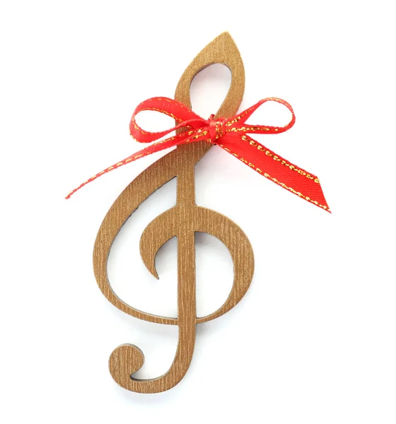 白い背景に赤いリボン結び目と木製ト音記号 クリスマス音楽のコンセプト — ストック写真
