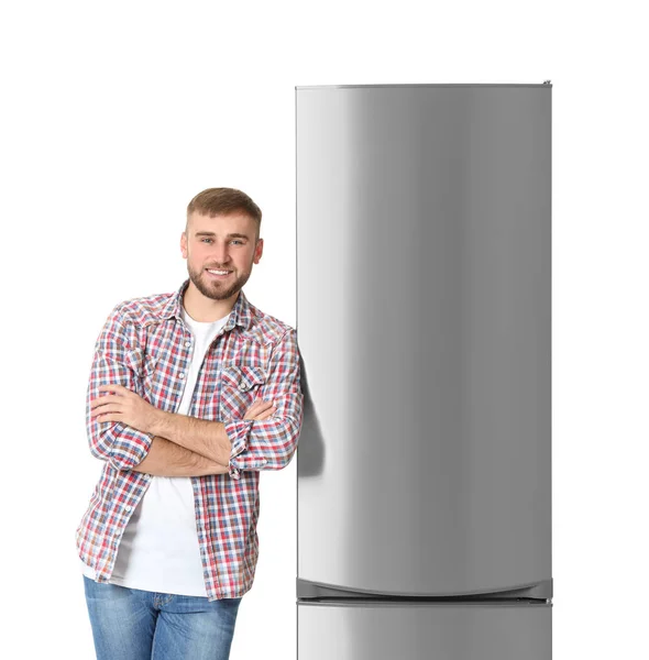 Молодой Человек Возле Закрытого Холодильника Белом Фоне — стоковое фото