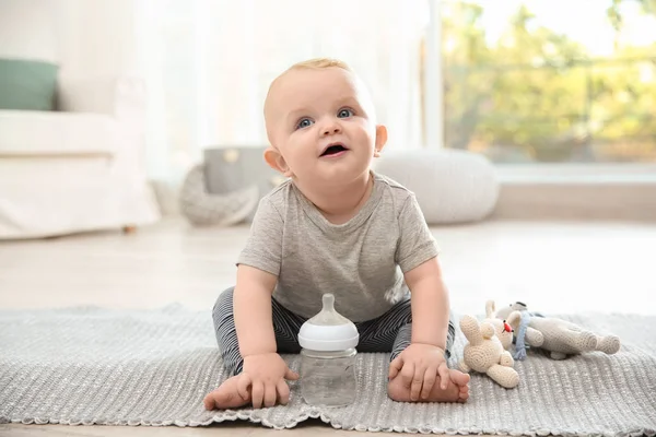 Cute Baby Bottle Sitting Floor Room — Stock Photo, Image