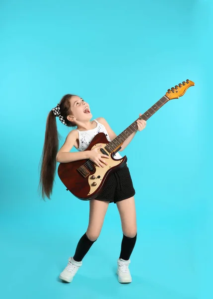 Cute Little Girl Playing Guitar Color Background — Stock Photo, Image