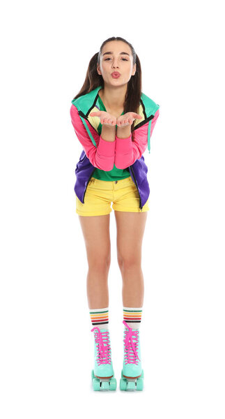 Full length portrait of young woman with roller skates on white background
