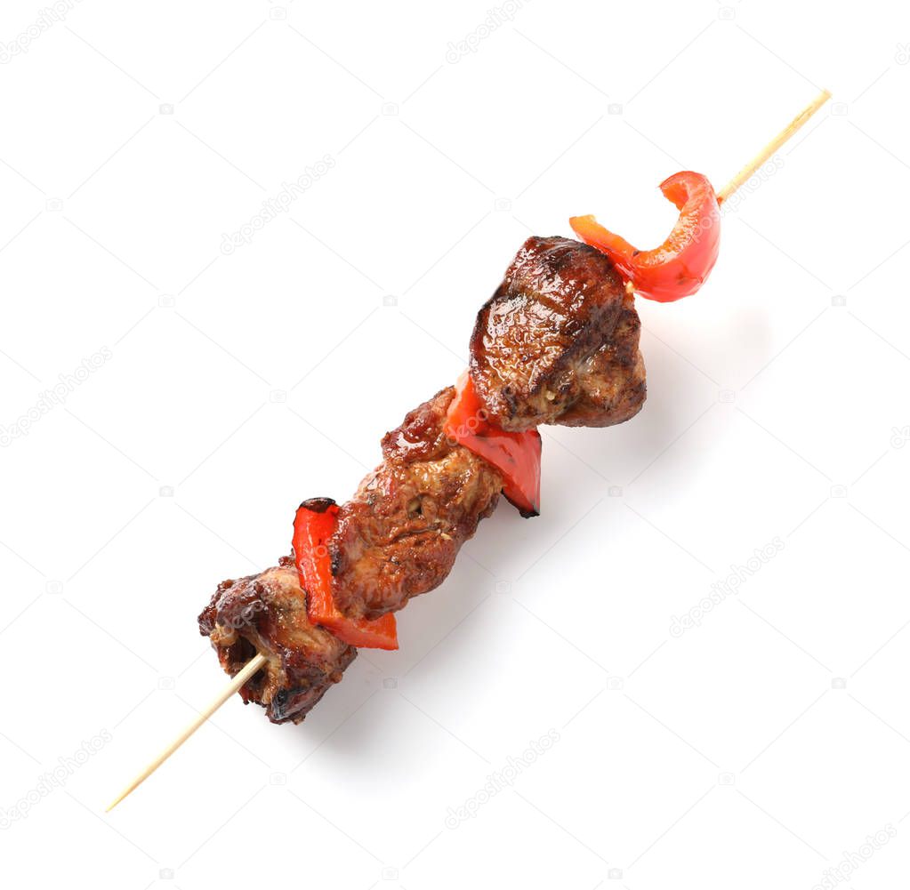 Skewer with delicious barbecued meat and pepper on white background, top view