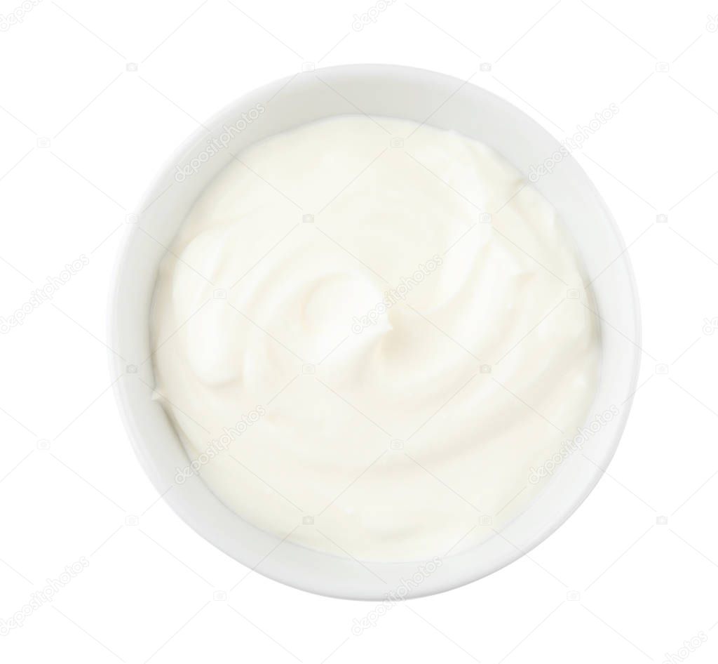 Bowl with sour cream on white background, top view
