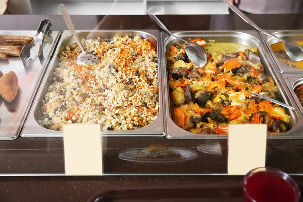 Containers with healthy food in school canteen