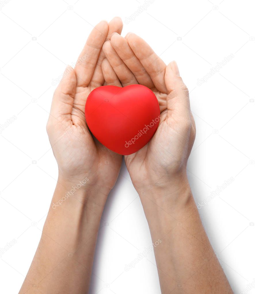 Woman holding red heart on white background, top view. Cardiology concept
