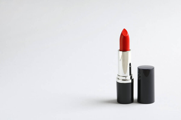 Bright lipstick on white background. Space for text