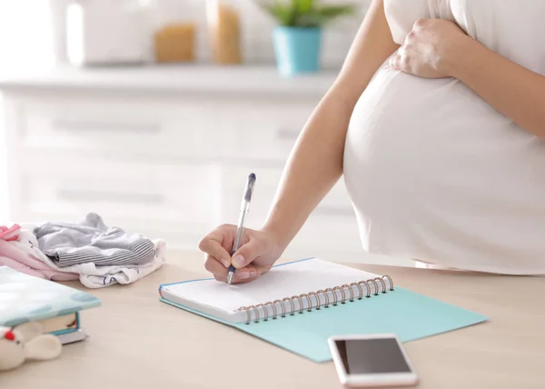 Pregnant Woman Writing Packing List Maternity Hospital Kitchen Closeup — Stock Photo, Image