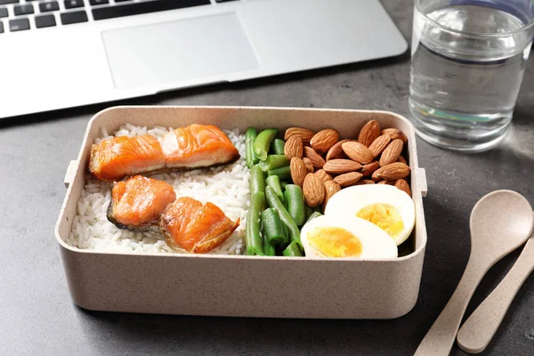 Container with natural protein food on office table