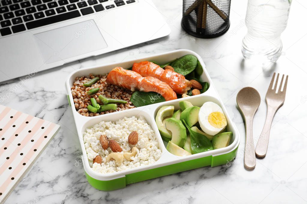 Container with natural protein food on office table