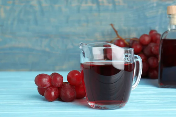 Glass Jug Wine Vinegar Fresh Grapes Wooden Table — Stock Photo, Image