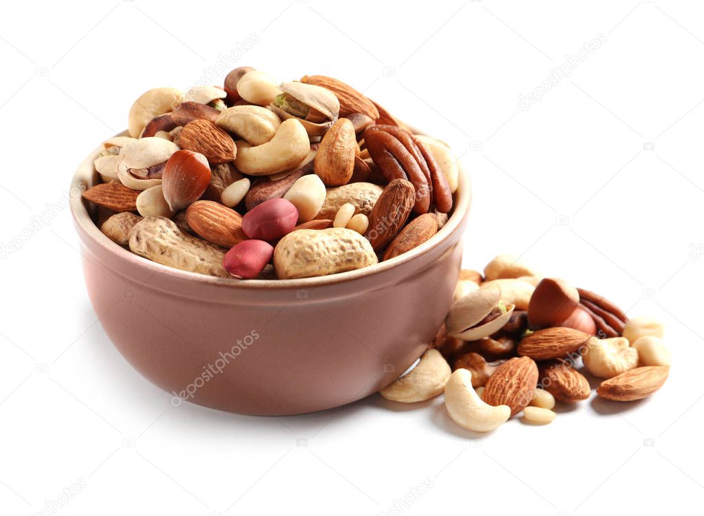 Bowl with mixed organic nuts on white background