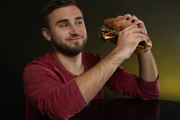 Young Hungry Man Tasty Burger Color Background — Stock Photo, Image