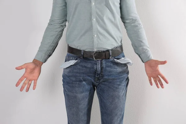 Man Showing Empty Pockets Light Background Closeup — Stock Photo, Image