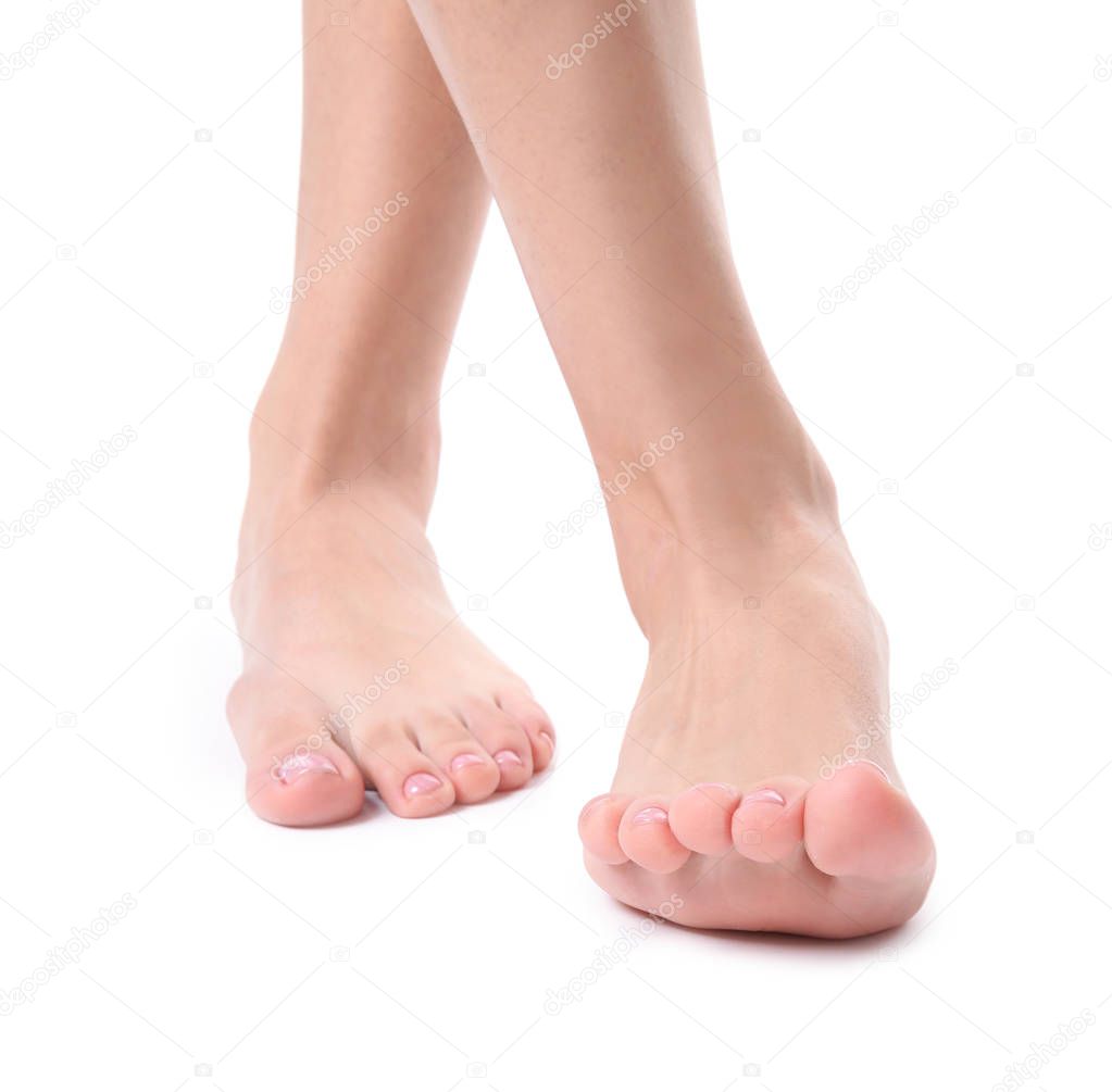 Woman with smooth feet on white background, closeup. Spa treatment