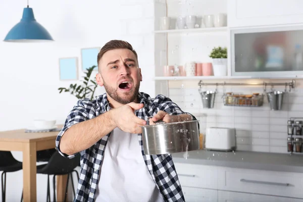 Emotional Young Man Holding Saucepan Water Leakage Ceiling Kitchen Space — Stock Photo, Image