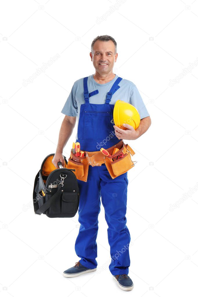 Electrician with tools and safety helmet wearing uniform on white background