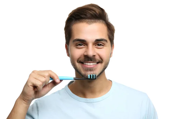 歯ブラシとペースト色の背景上に若い男の肖像画 テキストのためのスペース — ストック写真